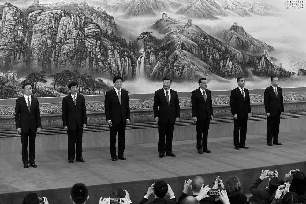 The Communist Party of China's new Politburo Standing Committee, the nation's top decision-making body (L-R) Han Zheng, Wang Huning, Li Zhanshu, Chinese President Xi Jinping, Premier Li Keqiang, Wang Yang, Zhao Leji meet the press at the Great Hall of the People in Beijing on October 25, 2017. (Wang Zhao/AFP/Getty Images)