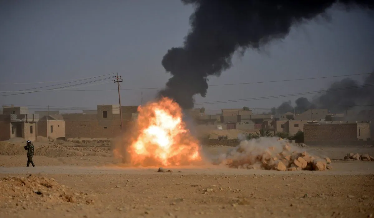 Shi'ite Popular Mobilization Forces (PMF) fighters fire a cannon against Islamic State militants in Al-Qaim, Iraq November 3, 2017. (Reuters/Stringer)