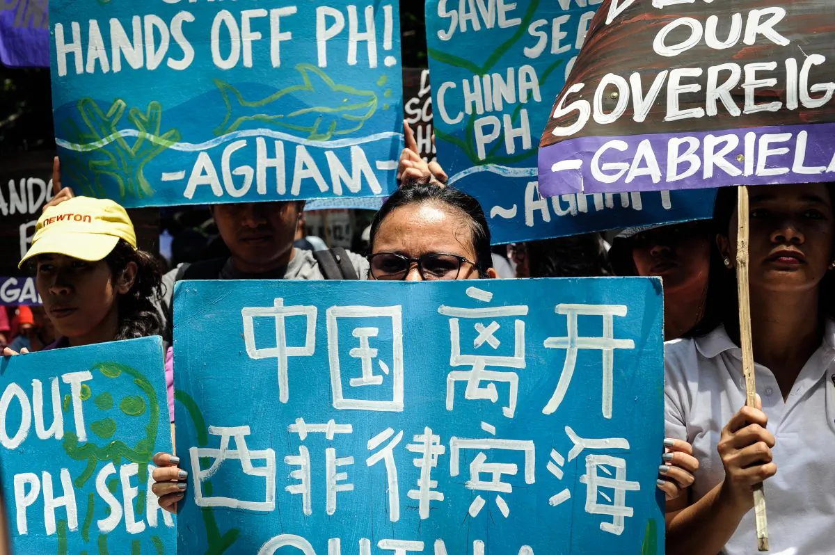 Anti-China protestors mount a protest rally against China's territorial claims in the South China Sea in front of the Chinese Consulate in Makati, Philippines, on July 12, 2016. Philippines brought the case to Permanent Court of Arbitration at The Hague to challenge China’s actions and claims in the South China Sea, which was ruled decisively in favor of the Philippines in July 2016. (Dondi Tawatao/Getty Images)