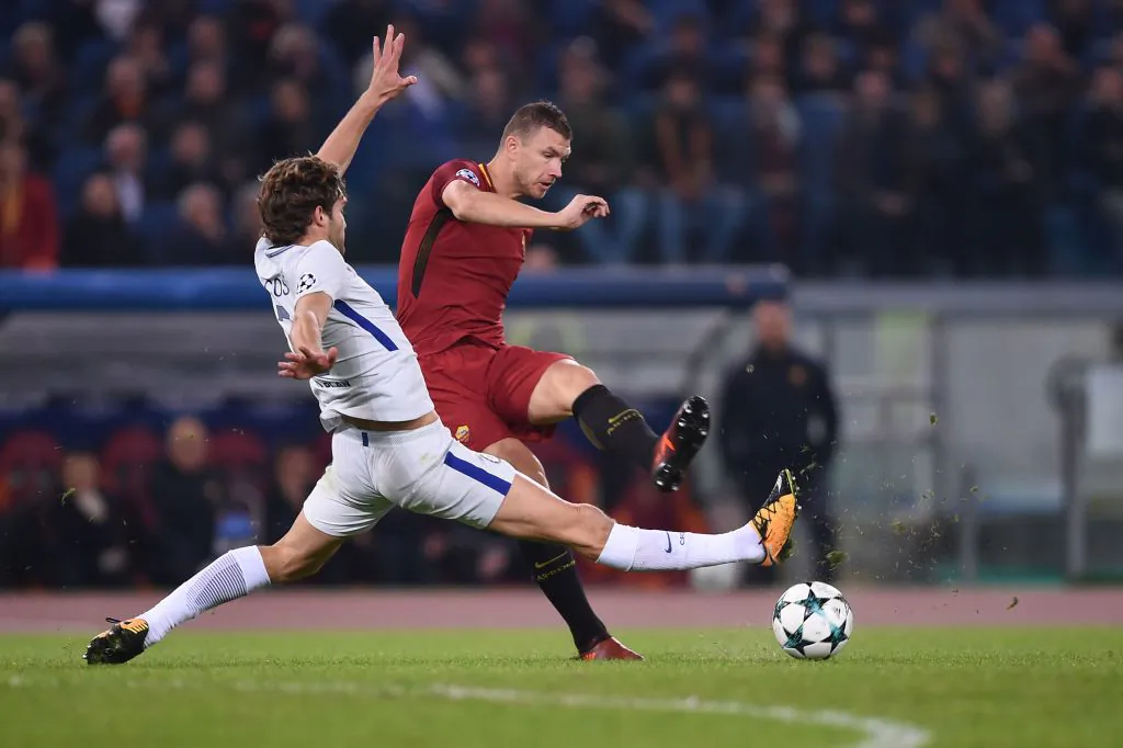Roma's Bosnian striker Edin Dzeko (R) kicks the ball next to Chelsea's Spanish defender Marcos Alonso during the UEFA Champions League football match AS Roma vs Chelsea on October 31, 2017 at the Olympic Stadium in Rome. (Filippo Monteforte/AFP/Getty Images)