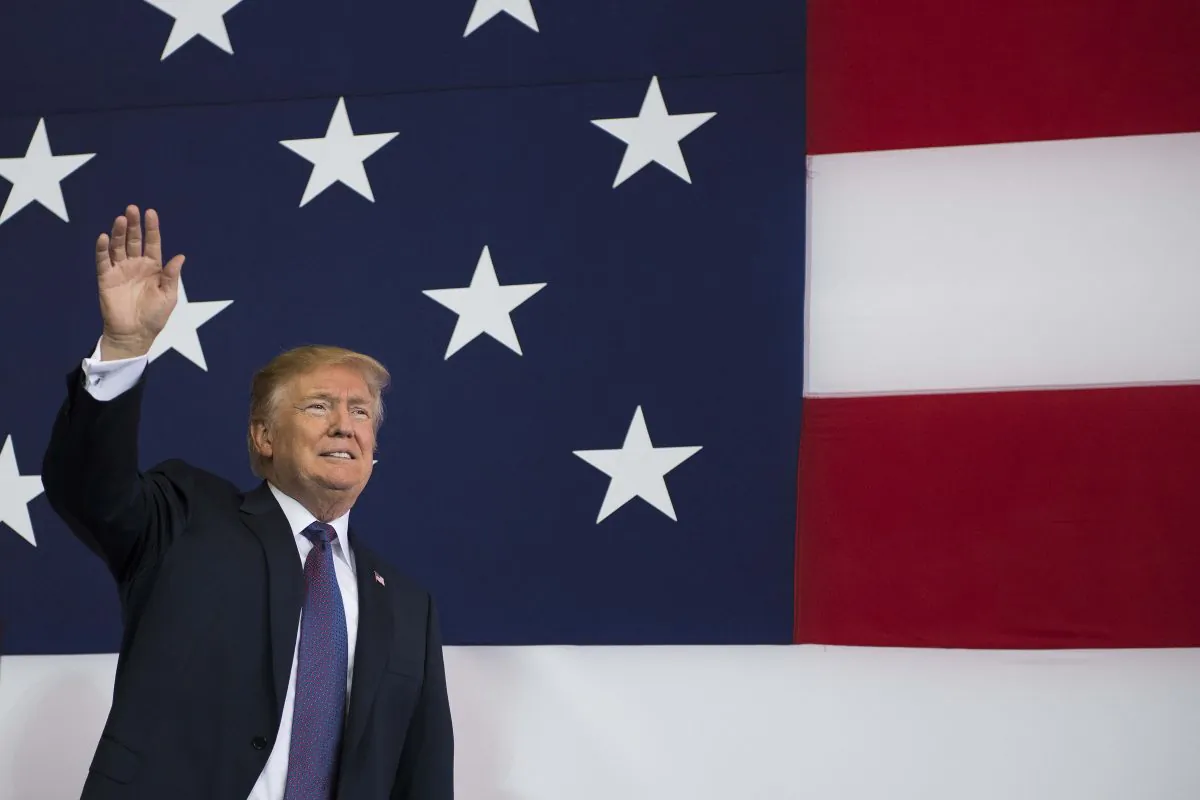 President Donald Trump waves as he arrives to speak to U.S. military personnel at Yokota Air Base in Tokyo on Nov. 5, 2017. (JIM WATSON/AFP/Getty Images)