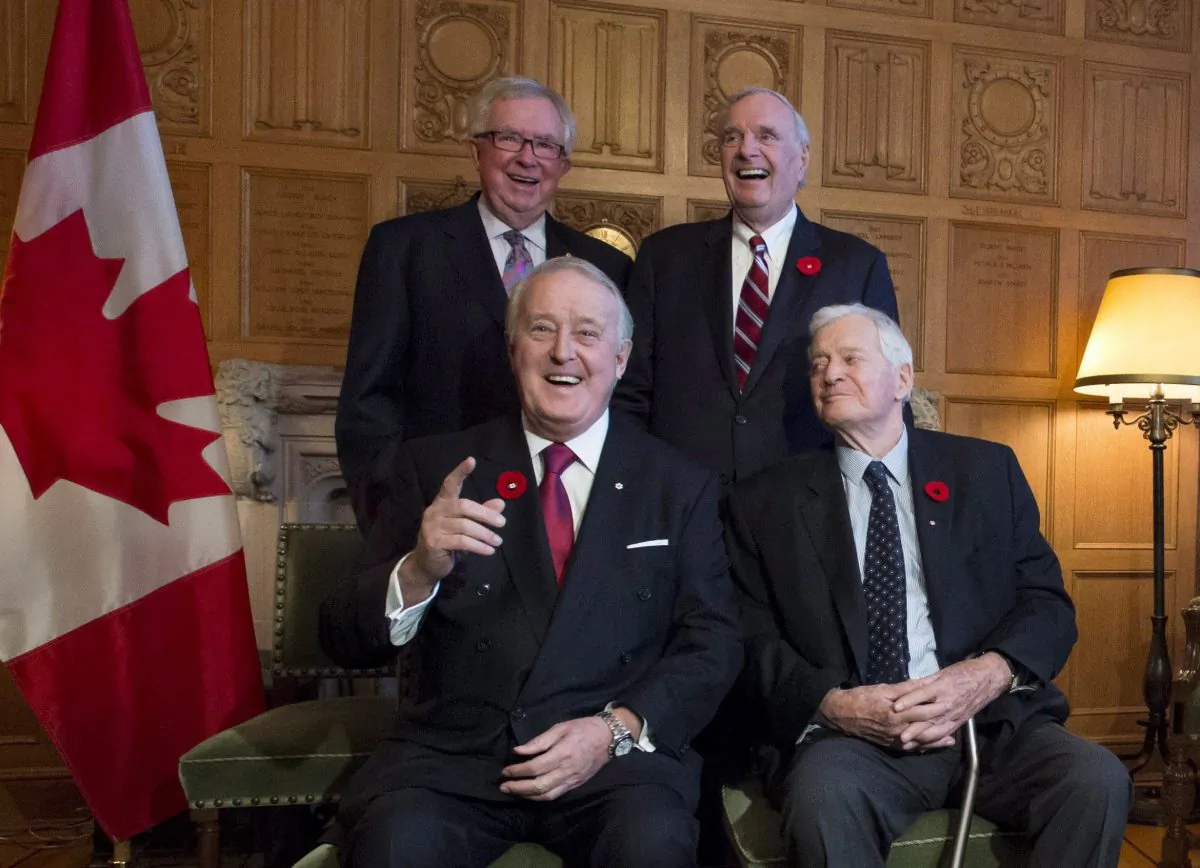 Former prime ministers Brian Mulroney (front L) and John Turner, with Joe Clark (rear L) and Paul Martin as they mark the 150th anniversary of the first meeting of the first Parliament of Canada, in Ottawa on Nov. 6, 2017. (The Canadian Press/Justin Tang)