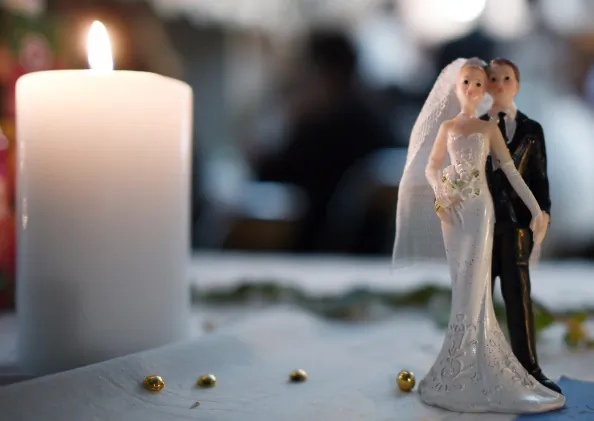 Bride and groom figurines are pictured on a table during a wedding party in Rennes, western France. (Damien Meyer/AFP/Getty Images)