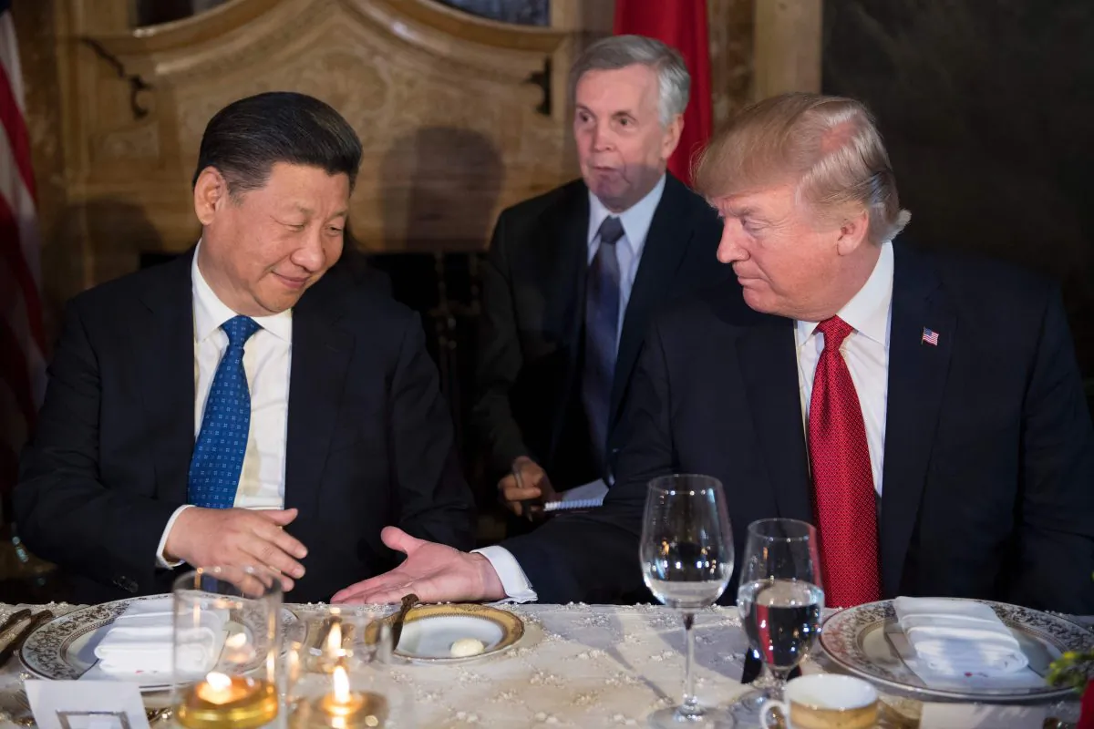 U.S. President Donald Trump (R) and Chinese leader Xi Jinping (L) prepare to shake hands during dinner at the Mar-a-Lago estate in West Palm Beach, Florida, on April 6, 2017. (Jim Watson/AFP/Getty Images)