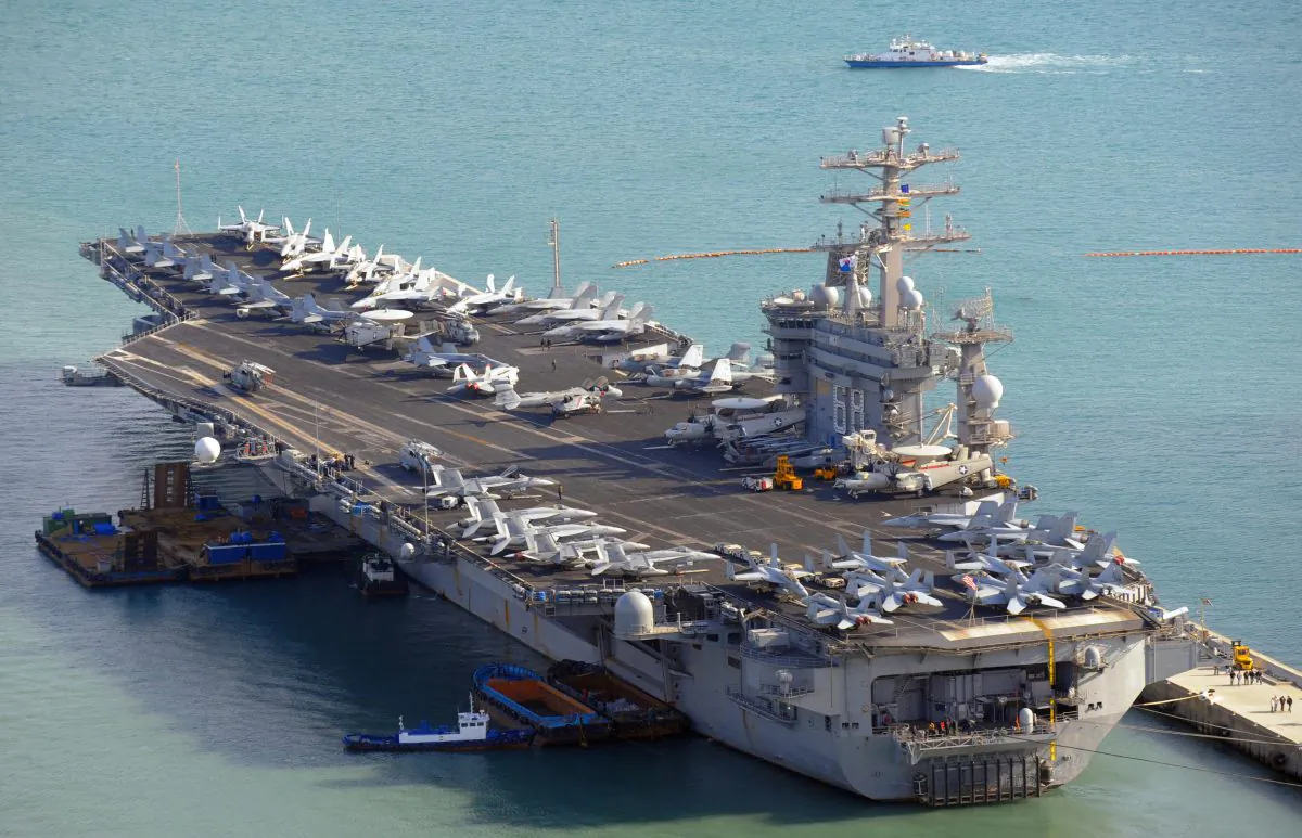 The USS Nimitz CVN 68, a nuclear-powered aircraft carrier, arrives at a naval base in the South Korean port city of Busan, some 450 kms southeast of Seoul on Feb. 28, 2008. The Nimitz and its associated strike group completed exercises with two other aircraft carriers in the Western Pacific on Nov. 14 2017, adding to the military posture aimed at pressuring Kim Jong Un to come to the negotiating table. (Kim Jae-Hwan/AFP/Getty Images)