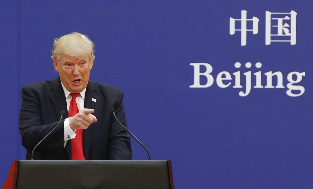 President Donald Trump and China's President Xi Jinping speak to business leaders at the Great Hall of the People in Beijing, China, on Nov. 9, 2017. (Thomas Peter-Pool/Getty Images)