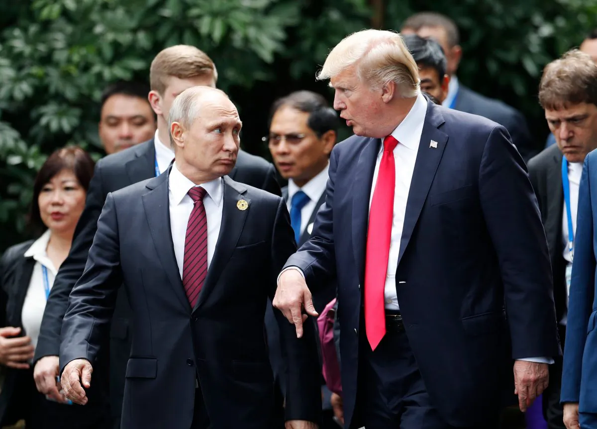 President Donald Trump and Russia's President Vladimir Putin talk during the Asia-Pacific Economic Cooperation (APEC) leaders' summit in the central Vietnamese city of Danang on Nov. 11. (JORGE SILVA/AFP/Getty Images)