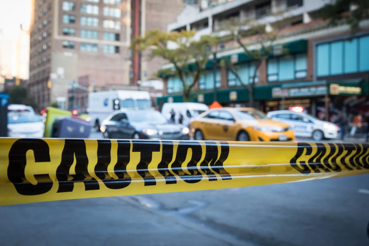 A stock photo of police tape (Benjamin Chasteen/The Epoch Times)
