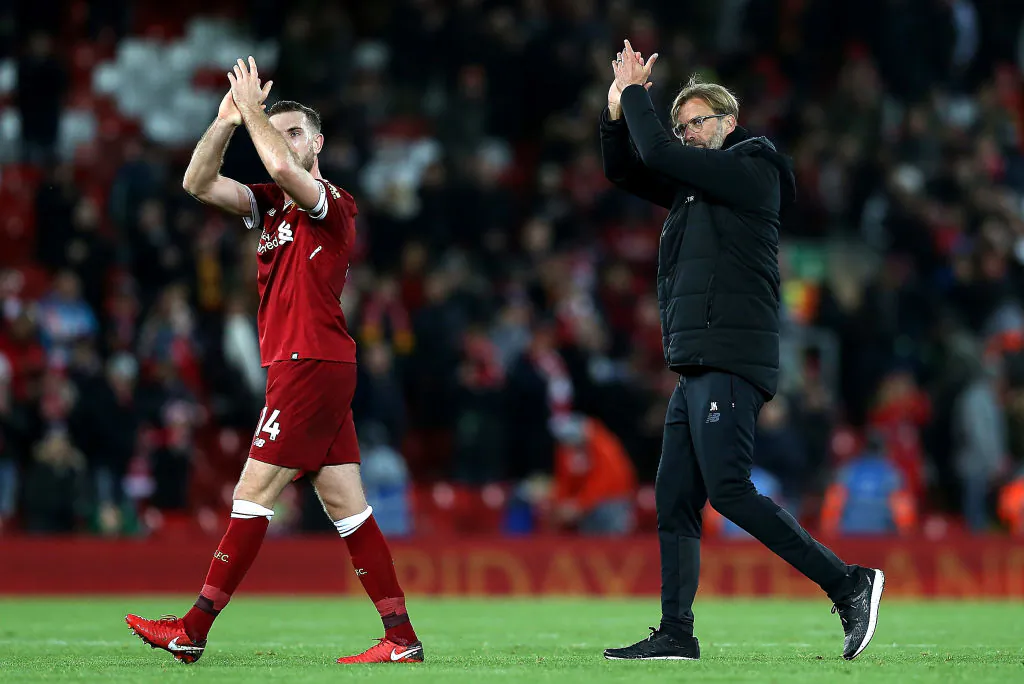 Manager Jurgen Klopp (R) and Jordan Henderson (L) of Liverpool applaud supporters after their 3-0 victory in the Premier League match between Liverpool and Southampton at Anfield on Nov 18, 2017 in Liverpool, England. (Jan Kruger/Getty Images)