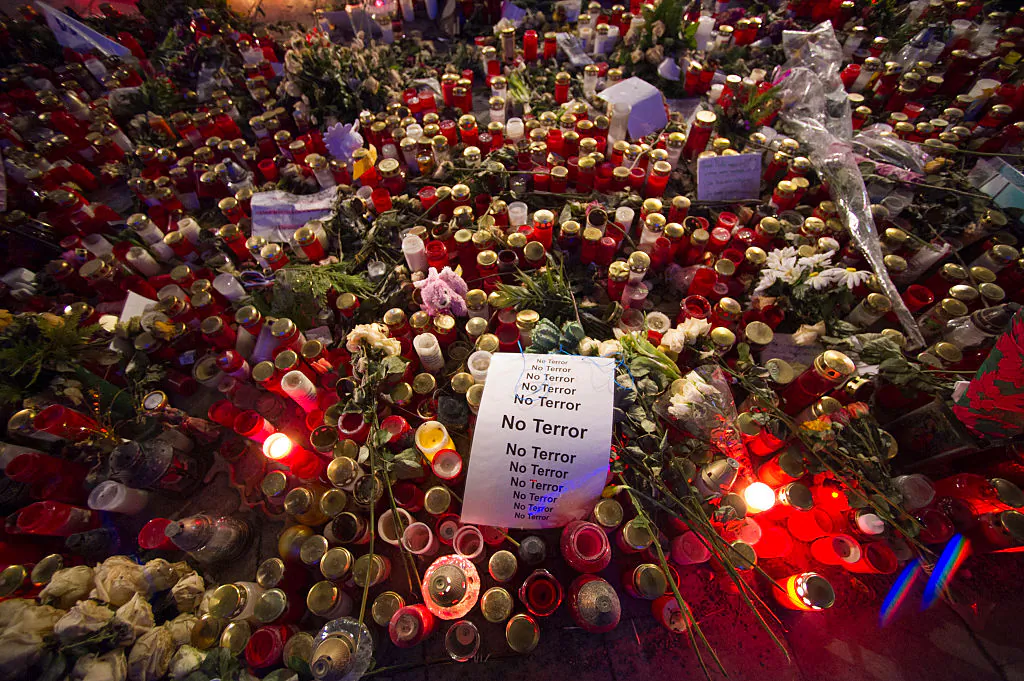A sign that reads "No Terror" lies on candles and flowers at a memorial for the Christmas market terror attack victims at Breitscheidplatz in Germany on Jan. 19, 2017. On Dec. 19, 2016 Anis Amri, a Tunisian radical, drove a heavy truck into a crowded Christmas market at Breitscheidplatz, killing 12 people and injuring 50. (Steffi Loos/Getty Images)