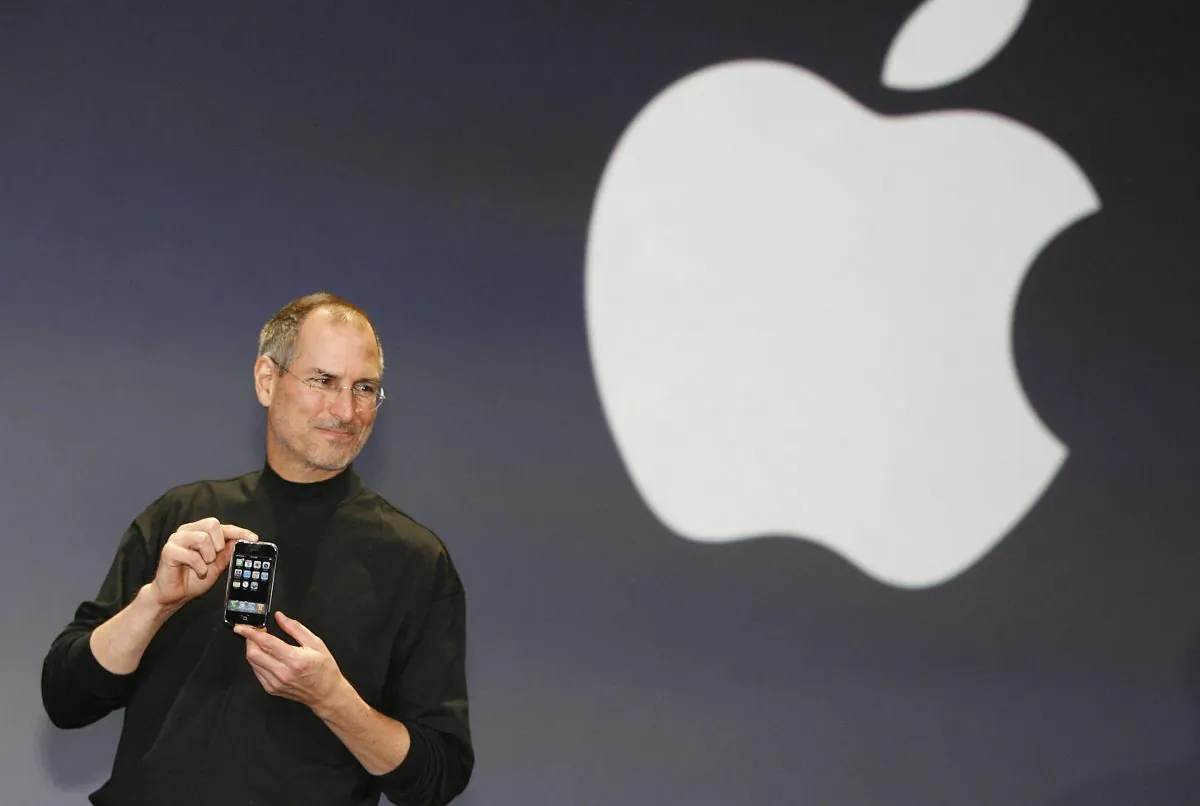 Apple CEO Steve Jobs unveils the first iPhone at the Macworld Conference in San Francisco on Jan. 9, 2007. Steve Jobs and Apple represent the power of producers to shape price and consumer choices. (TONY AVELAR/AFP/Getty Images)