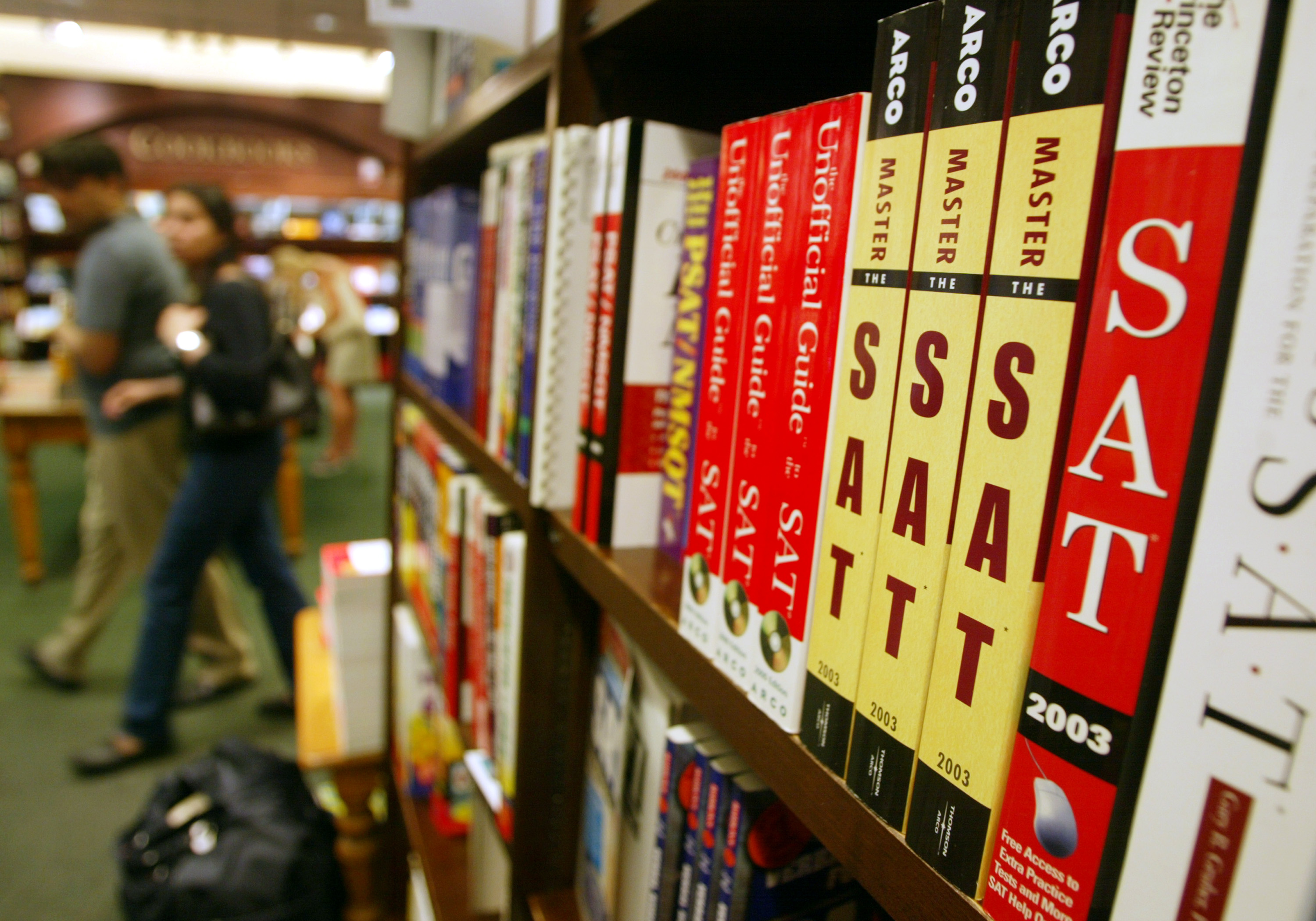 SAT test preparation books sit on a shelf