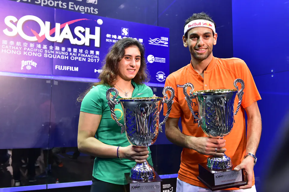 World No 1 Nour El Sherbini  and  Mohamed Elshorbagy display their trophies after winning the finals of the Hong Kong Squash Open 2017, in Hong Kong on Sunday Nov 19. (Bill Cox/Epoch Times)