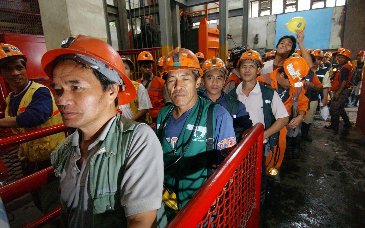 Filipino miners make their way out after their work in the mine tunnel of Philex Mining Corp., in Padcal, northern Benguet province, 27 May 2006. Mineralogists, geologists, mining engineers and experts in related fields have become the star targets of headhunting firms as foreign investors pour into the Southeast Asian country's resources sector. (Romeo Gacad/AFP/Getty Images)