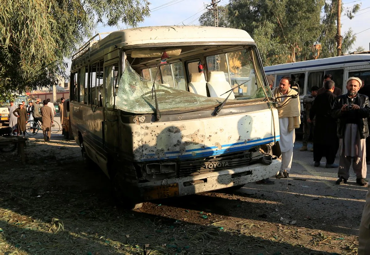 People look at a damaged bus after a suicide attack in Jalalabad city, Afghanistan November 23, 2017. In a separate incident, ISIS terrorists in the region beheaded 15 of their own (Reuters/Parwiz)