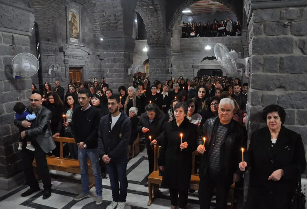 Syrian Christians attend a Good Friday mass at the Saint Mary church of the Holy Belt in the old part of the country's central city of Homs on April 14, 2014. (STR/AFP/Getty Images)