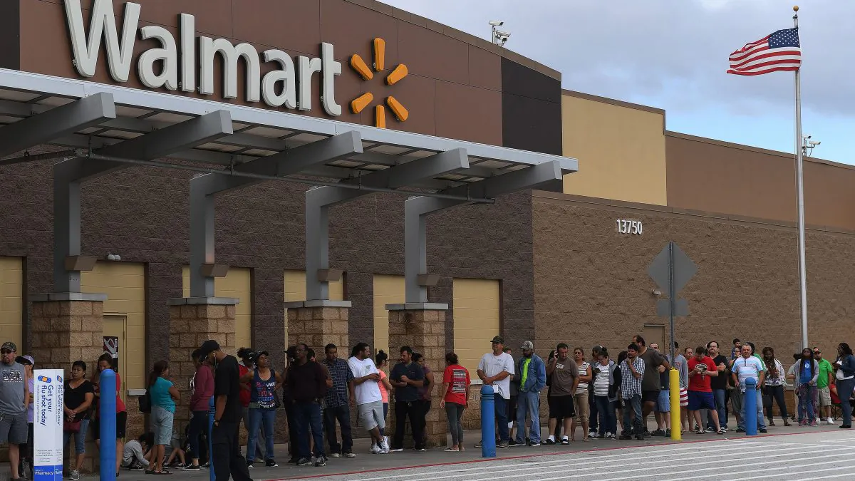 People wait in line for a Walmart store to open in Houston, Texas on August 30, 2017. (Mark Ralston/AFP/Getty Images)