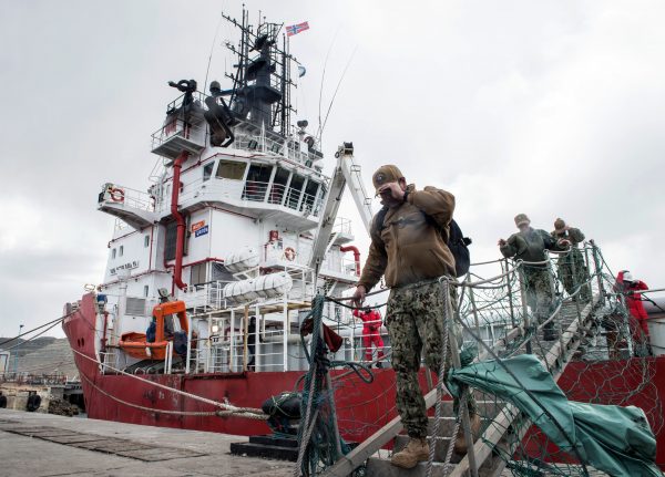 Members of the U.S. Navy Undersea Rescue Command (URC) disembark from the Sophie Siem vessel moored at Comodoro Rivadavia harbour after installing their deep diving rescue vehicle - the Pressurized Rescue Module (PRM) of the Submarine Rescue Diving and Recompression System (SRDRS) - to support the search and rescue efforts for the Argentine missing submarine ARA San Juan in Comodoro Rivadavia, Chubut province, Argentina on November 26, 2017.<br /> Weather conditions for the search were good on November 25 -- better than the difficult stormy weather of the past week -- but likely to deteriorate on 26. An army of welders worked frantically to create an opening in the stern of the Norwegian offshore supply ship Sophie Siem, owned by oil company Total, large enough to accommodate an underwater rescue capsule sent by the US Navy. The US capsule can rescue up to 16 trapped submarine sailors at a time in shifts of 20 minutes, experts said. / AFP PHOTO / PABLO VILLAGRA (Photo credit should read PABLO VILLAGRA/AFP/Getty Images)