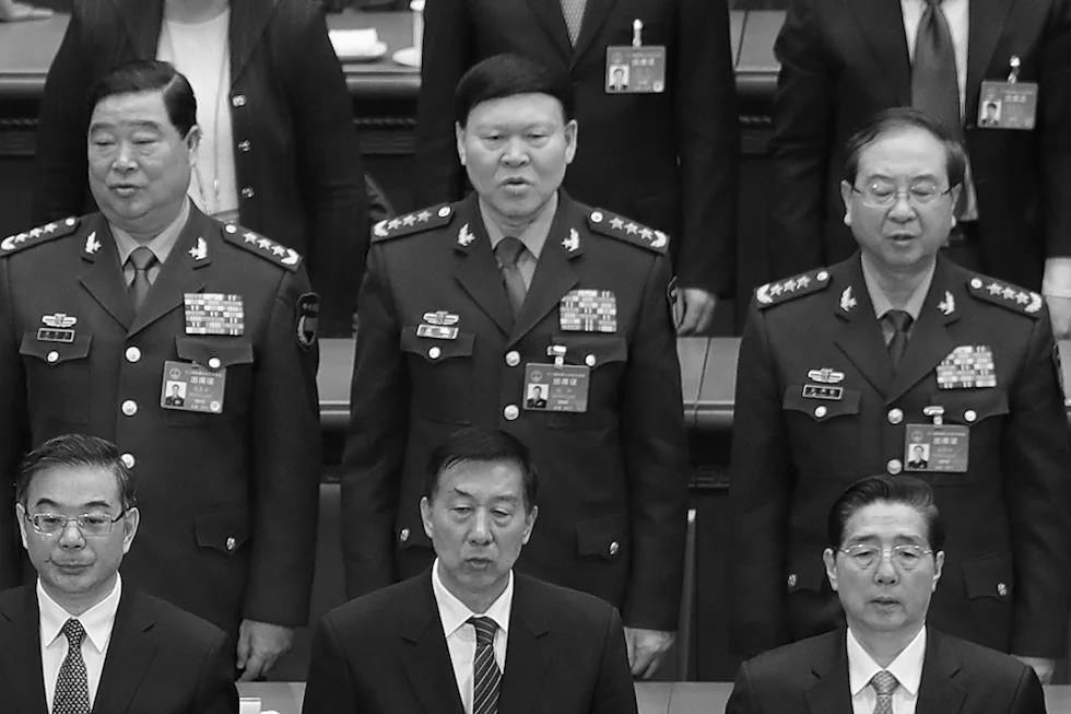 Zhang Yang (center), former member of the Central Military Commission, with other Chinese Communist Party officials at a meeting of the 12th National People's Congress at the Great Hall of the People in Beijing, China, on March 15, 2017. (Photo by Lintao Zhang/Getty Images)