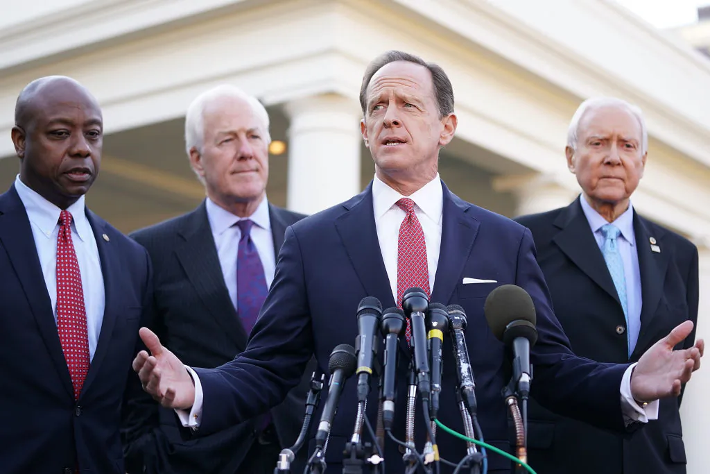 Senate Finance Committee members (L–R) Sen. Tim Scott (R-SC), Sen. John Cornyn (R-TX), Sen. Pat Toomey (R-PA) and Chairman Orrin Hatch (R-UT) talk with reporters following a lunch meeting with President Donald Trump at the White House, in Washington on Nov. 27, 2017 . (Chip Somodevilla/Getty Images)