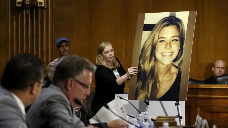 A photo of murder victim Kate Steinle is placed on an easel as her father Jim Steinle (2nd L) prepares to testify about her murder during a hearing of the Senate Judiciary Committee on U.S. immigration enforcement policies, on Capitol Hill in Washington, DC, U.S. on July 21, 2015. (REUTERS/Jonathan Ernst/File Photo)