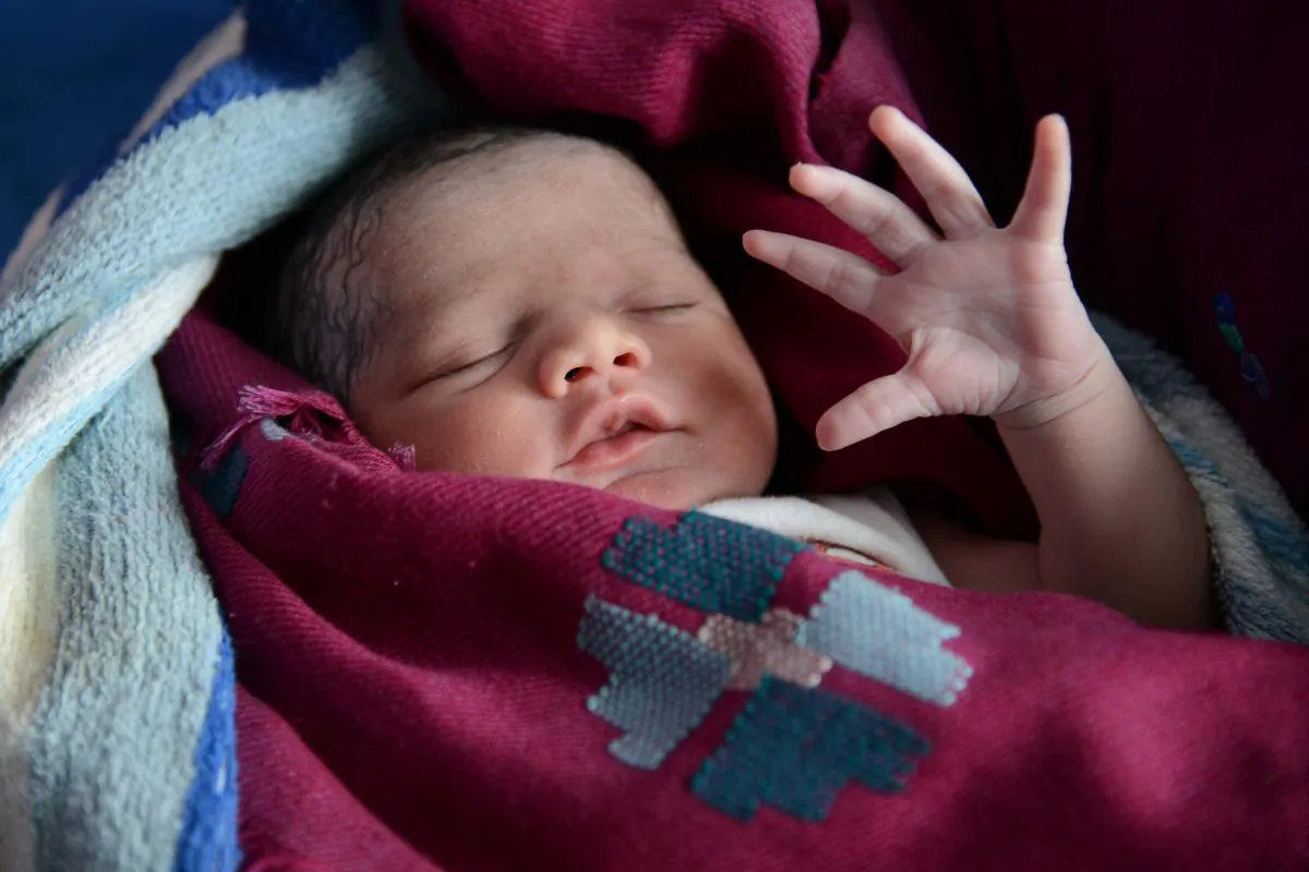 A newborn baby is pictured in India on July 11, 2013. (Narinder Nanu/AFP/Getty Images)