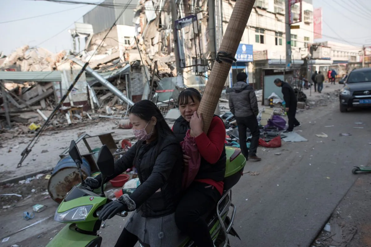 People leaving their homes on the outskirts of Beijing, after receiving eviction notices, in a photo taken on November 27, 2017. (Fred Dufour/AFP/Getty Images)
