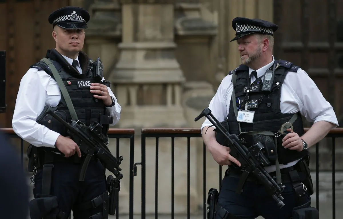 Armed British Police officers stand on duty outside of the Houses of Parliament in Westminster, central London on May 23, 2017, following the terror attack at the Ariana Grande concert at the Manchester Arena in Manchester on May 22. (Daniel Leal-Olivas/AFP/Getty Images)