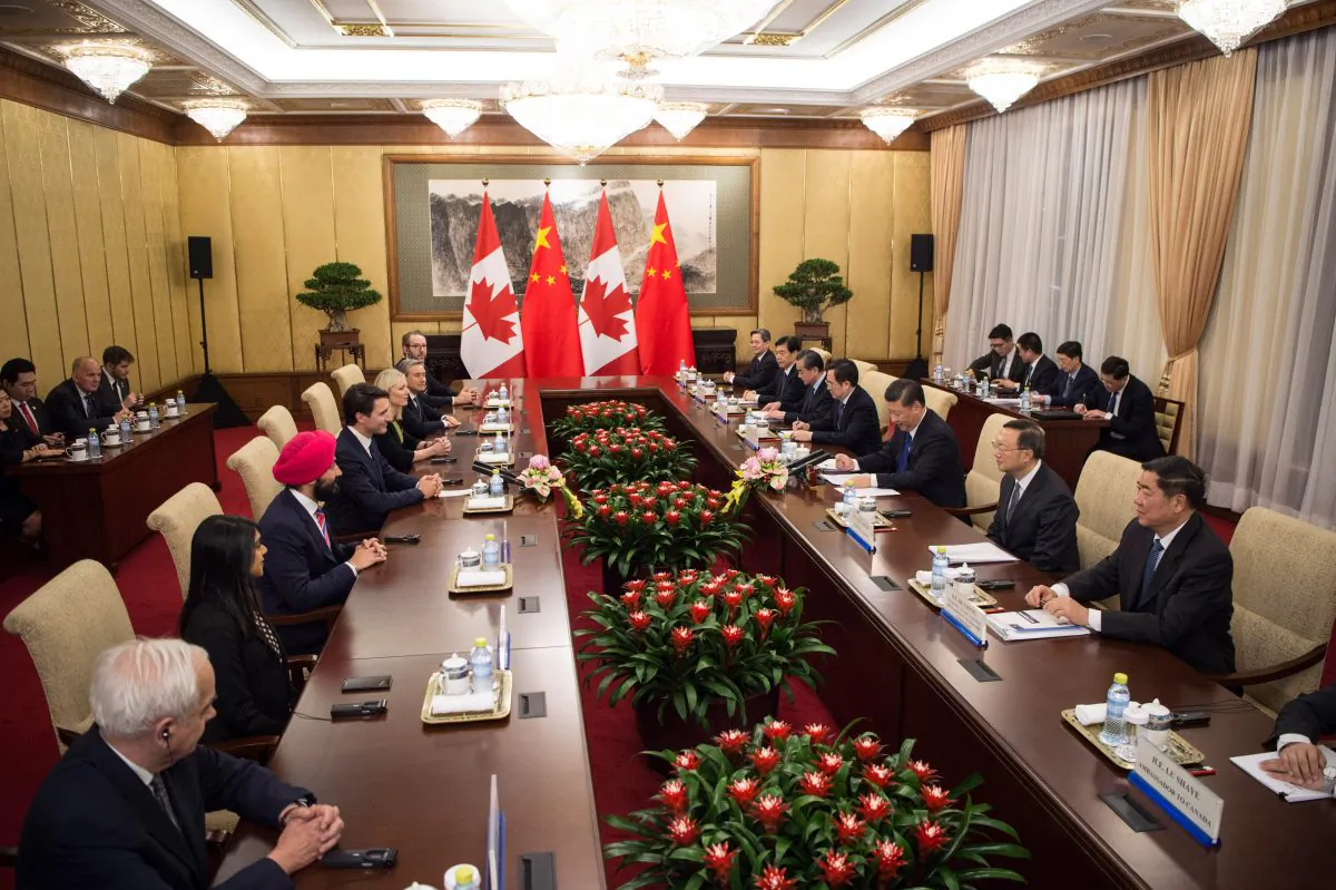 Canadian Prime Minister Justin Trudeau (4th L) speaks to Chinese leader Xi Jinping (3rd R) during a meeting at the Diaoyutai State Guesthouse on Dec. 5, 2017, in Beijing. (Fred Dufour/AFP/Getty Images)
