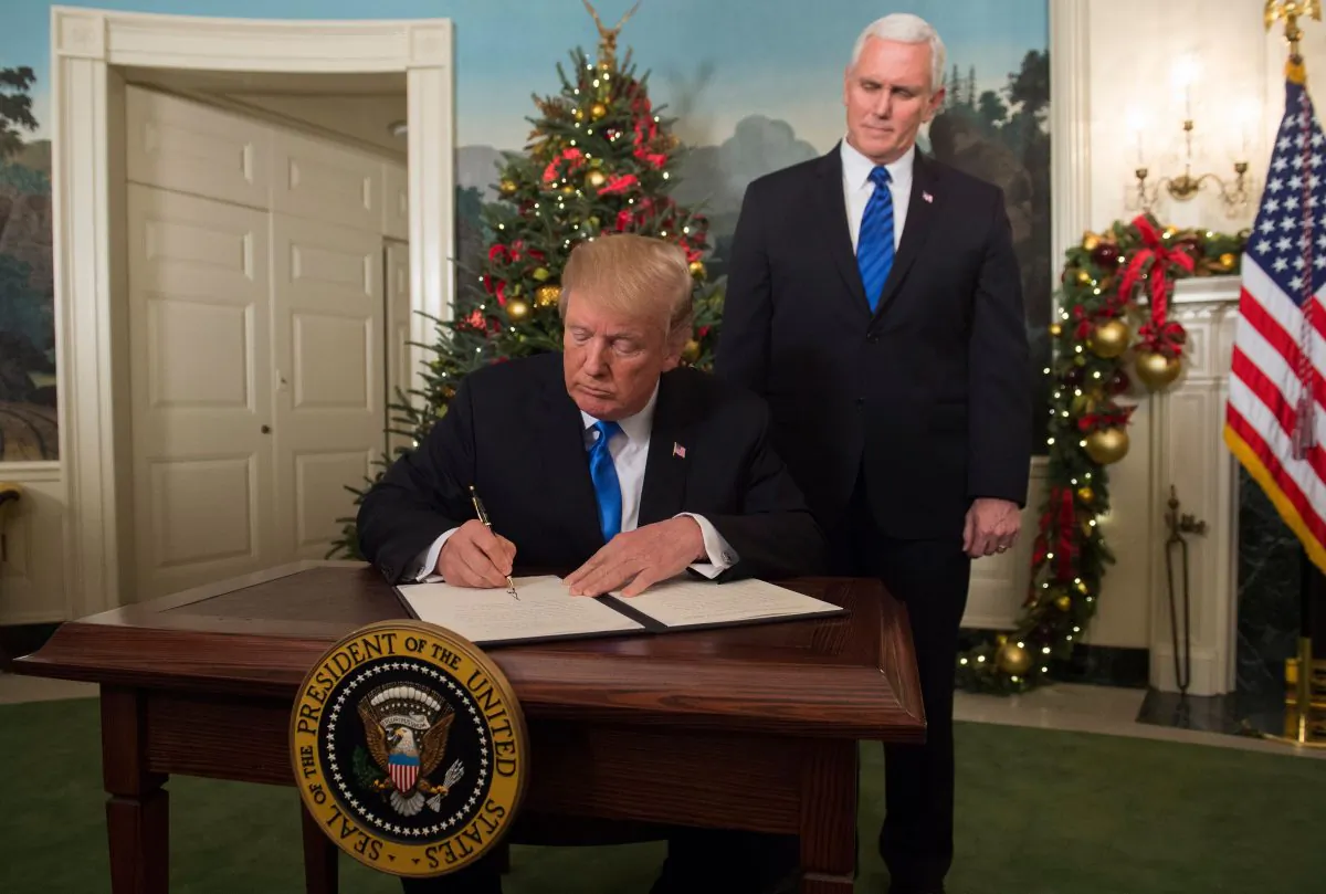 President Donald Trump signs a proclamation after delivering a statement on Jerusalem on Dec. 6. (SAUL LOEB/AFP/Getty Images)