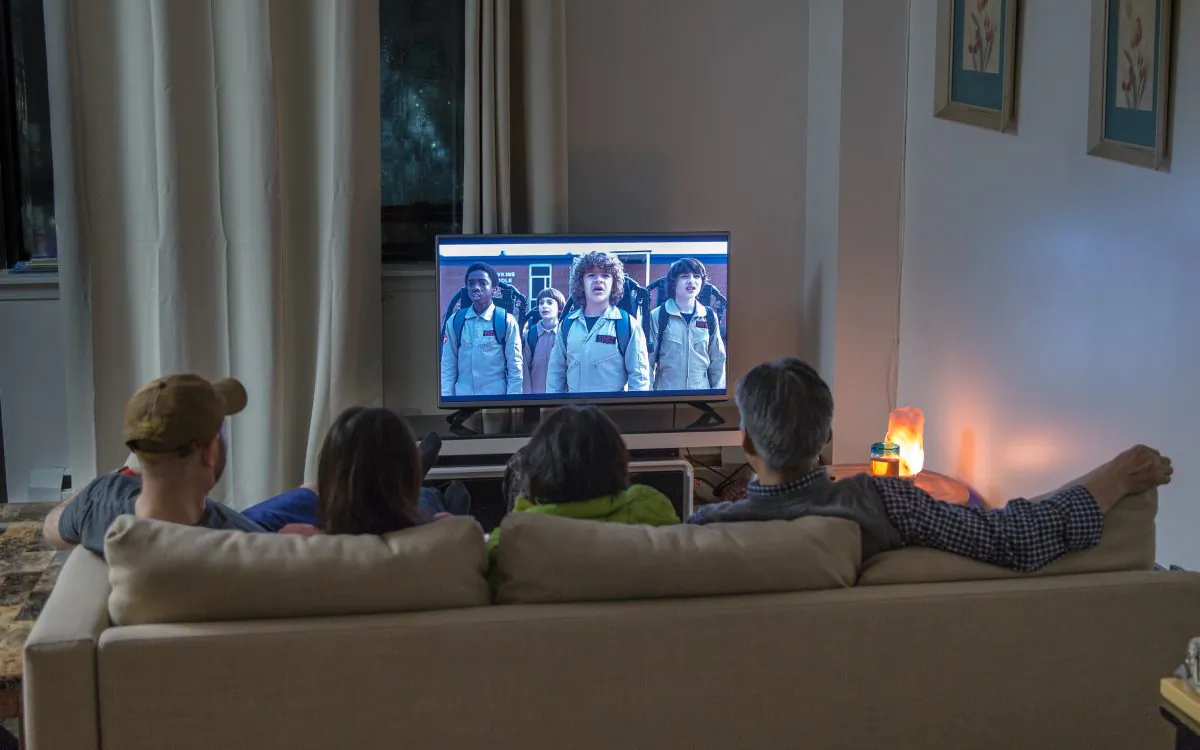 A family streams the Netflix show "Stranger Things" at their home in Queens, New York, on Dec. 6, 2017. (Benjamin Chasteen/The Epoch Times)