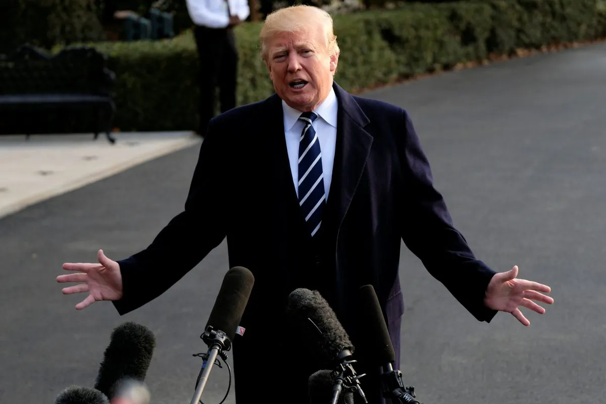 U.S. President Donald Trump speaks to reporters before departing the White House for New York in Washington, U.S., Dec. 2, 2017. (Reuters/James Lawler Duggan)