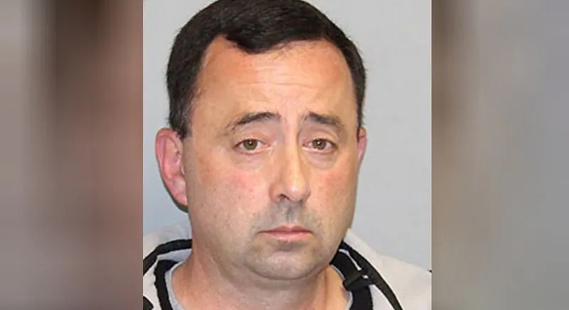 Former USA Gymnastics' team physician Larry Nassar poses in this handout photo received November 10, 2017. (Department of Attorney General/Handout via REUTERS)