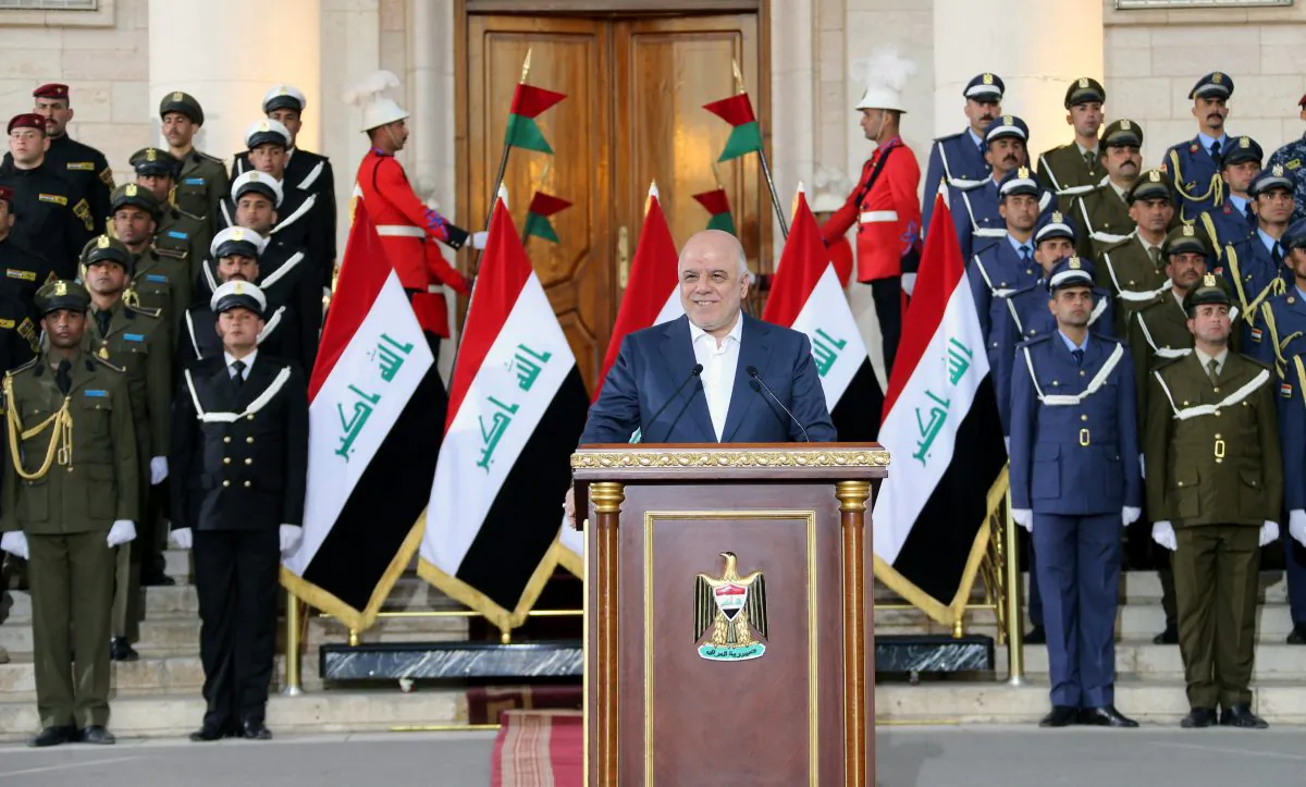 Iraqi Prime Minister Haider al-Abadi delivers a speech in Baghdad, Iraq, December 9, 2017. (Iraqi Prime Minister Media Office/Handout via Reuters)