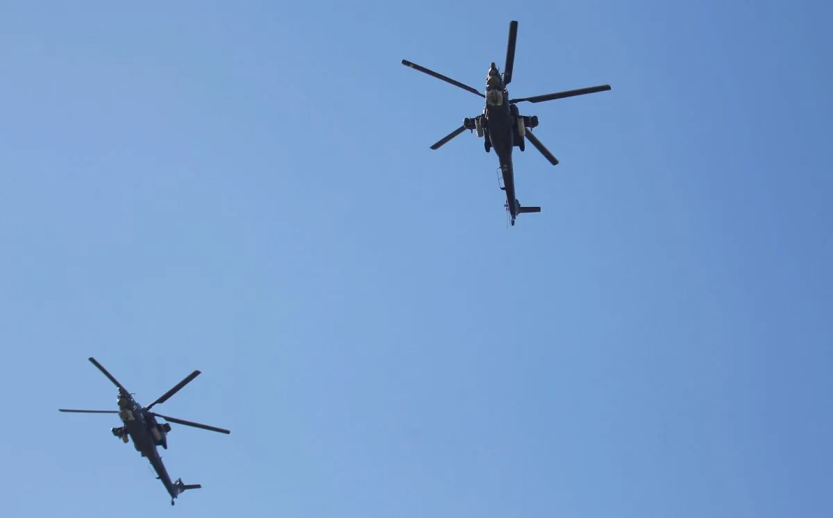 Iraqi helicopters fly during an Iraqi military parade in Baghdad, Iraq, on Dec. 10, 2017. (Khalid al-Mousily/Reuters)
