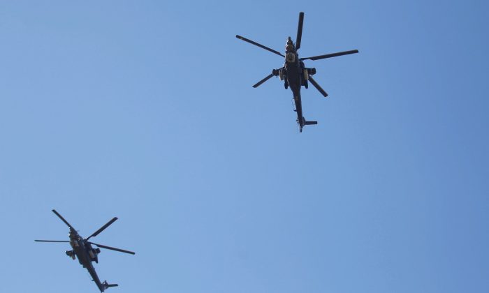 Iraqi helicopters will fly during the Iraqi military parade in Baghdad, Iraq on December 10, 2017.  (Khalidal-Mousily / Reuters)