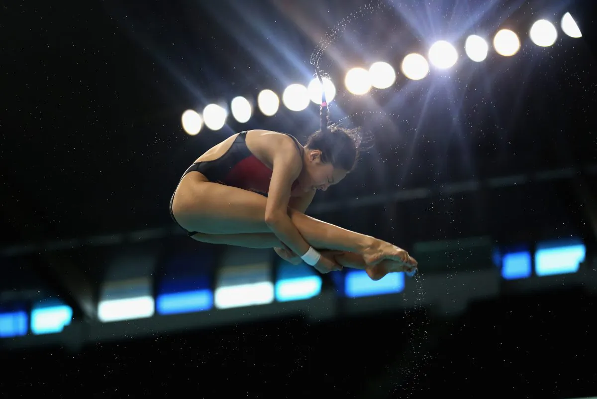 Han Wang of China dives in the Women's 3m Springboard finals during the FINA/NVA Diving World Series 2014 at the Hamdan Sports Complex in Dubai on March 21, 2014. (Warren Little/Getty Images)