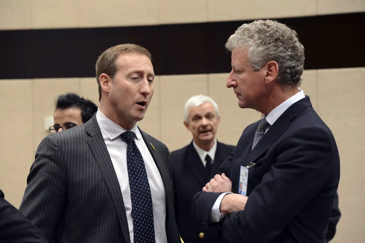 Then-Canadian defence minister Peter MacKay talks to his Belgian counterpart Pieter De Crem during a North Atlantic Council meeting of Ministers of Defence and ISAF partners at NATO headquarters in Brussels on Feb. 22, 2013. (Thierry Charlier/AFP/Getty Images)