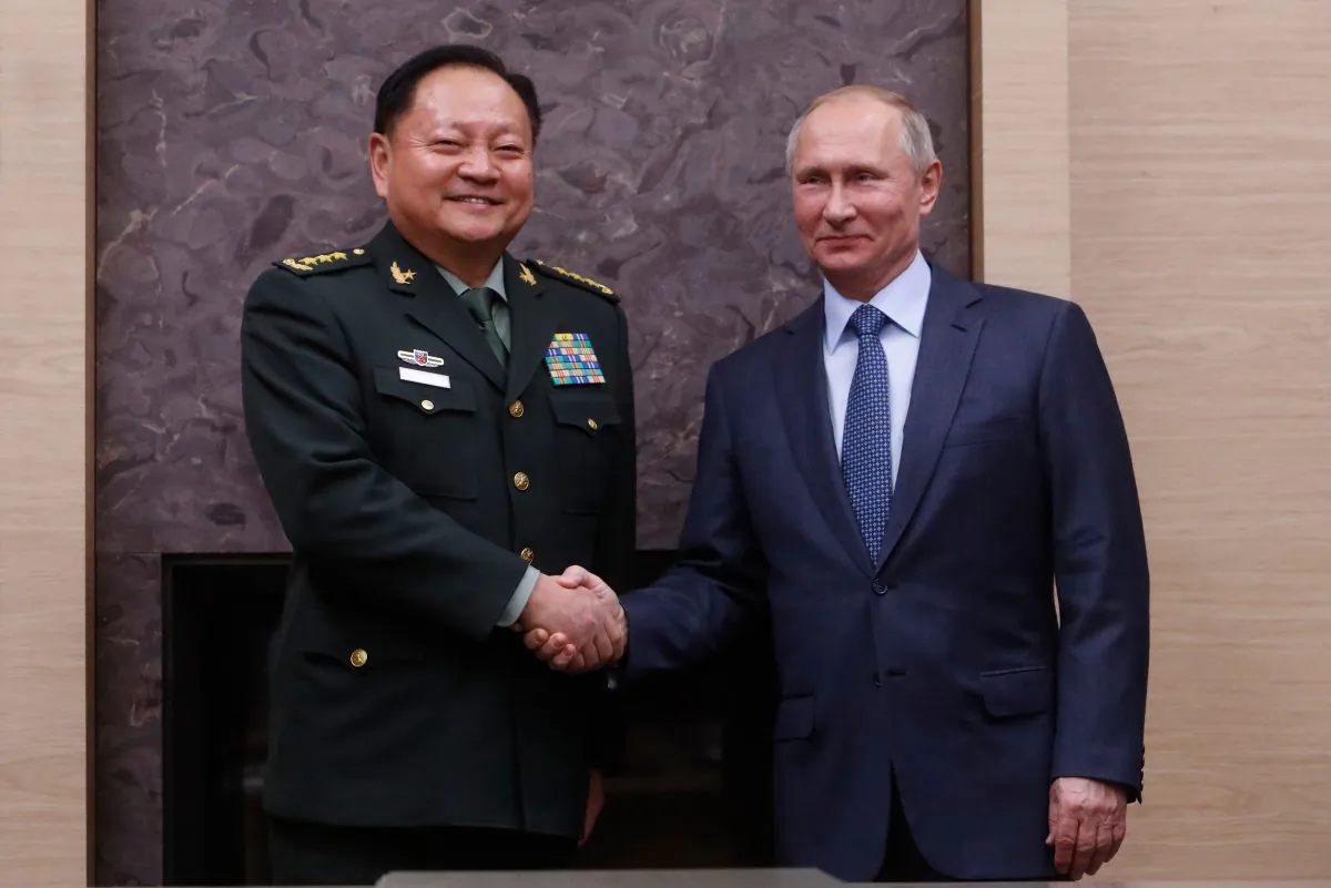 Russian President Vladimir Putin (R) meets with China's Central Military Commission Vice Chairman Zhang Youxia at the Novo-Ogaryovo state residence outside Moscow on Dec. 7, 2017. (Sergei Karpukhin /AFP/Getty Images)