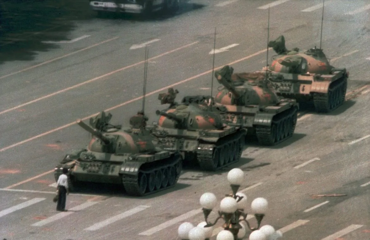 A Chinese man stands alone to block a line of tanks heading east on Beijing’s Cangan Blvd. on June 5, 1989 in Tiananmen Square, during the 1989 Tiananmen Square Massacre. (Jeff Widener/AP)