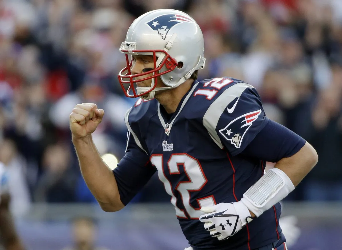New England Patriots quarterback Tom Brady on Nov. 23, 2014, in Foxborough, Mass. He wears a wristband with plays on his left wrist. (AP Photo/Steven Senne)