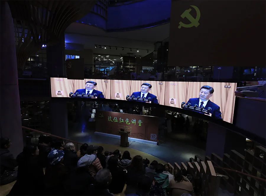 War veterans and local residents watch Chinese leader Xi Jinping give an address at the 19th National Congress on television, at a bookstore in Shenyang City in China's northeastern Liaoning Province on October 18, 2017.(STR/AFP/Getty Images)
