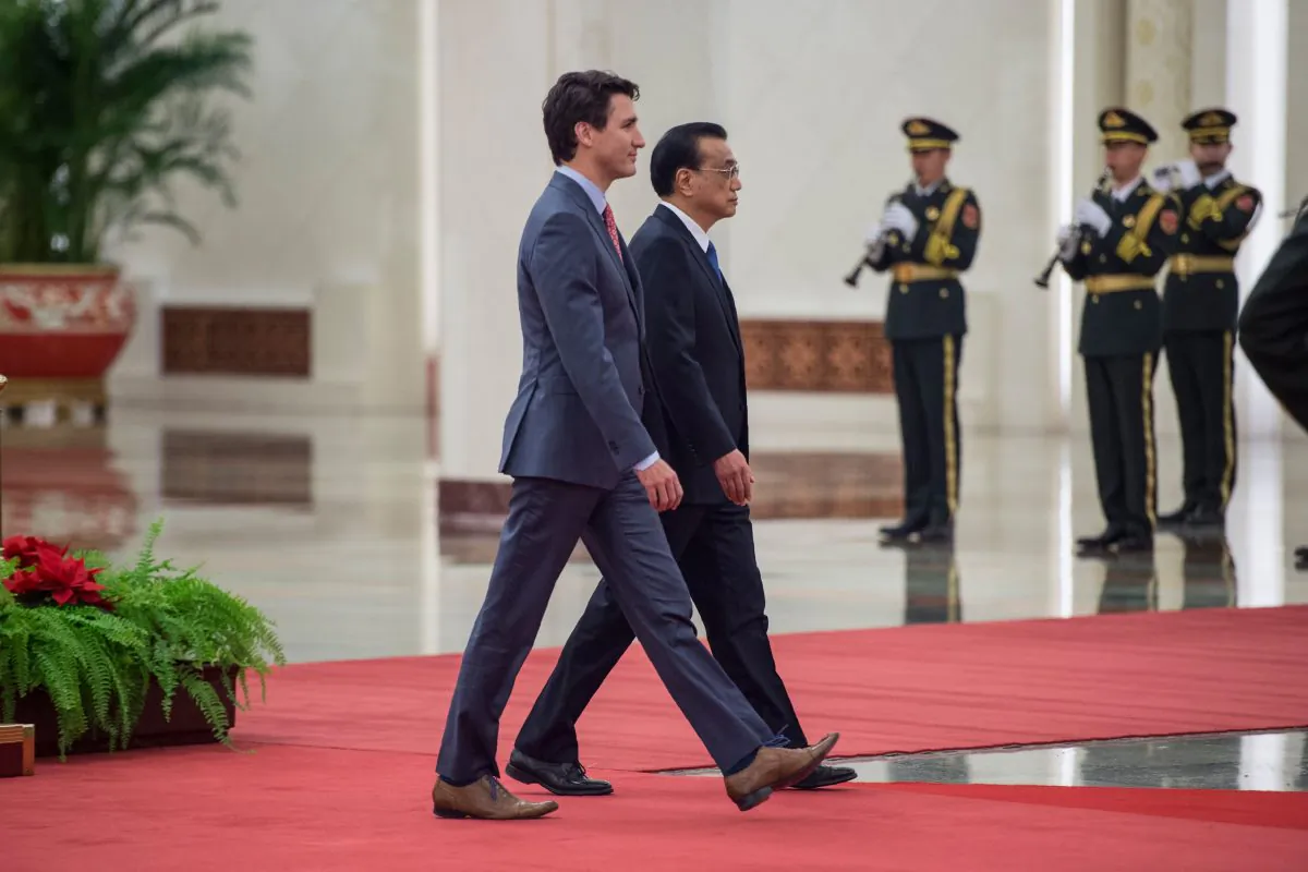 Canadian Prime Minister Justin Trudeau walks with Chinese Premier Li Keqiang at the Great Hall of the People in Beijing on Dec. 4, 2017. (Fred Doufour/AFP/Getty Images)