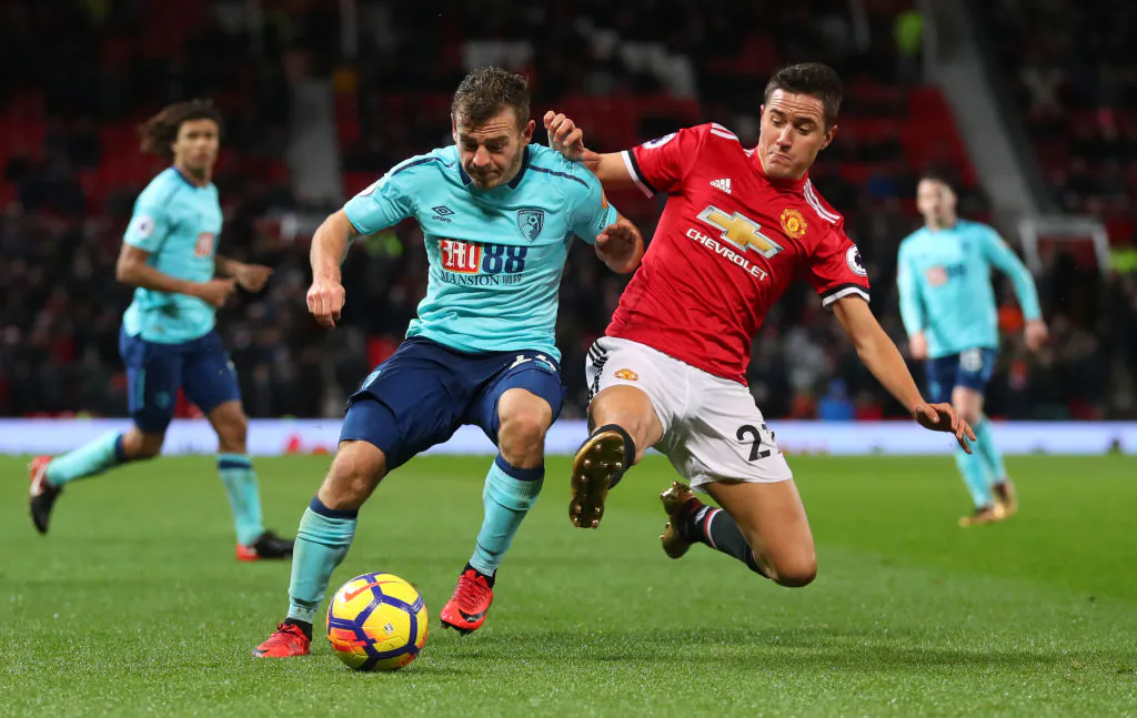 Ryan Fraser of AFC Bournemouth is tackled by Ander Herrera of Manchester United during the Premier League match between Manchester United and AFC Bournemouth at Old Trafford on Dec 13, 2017 in Manchester, England. (Catherine Ivill/Getty Images)

