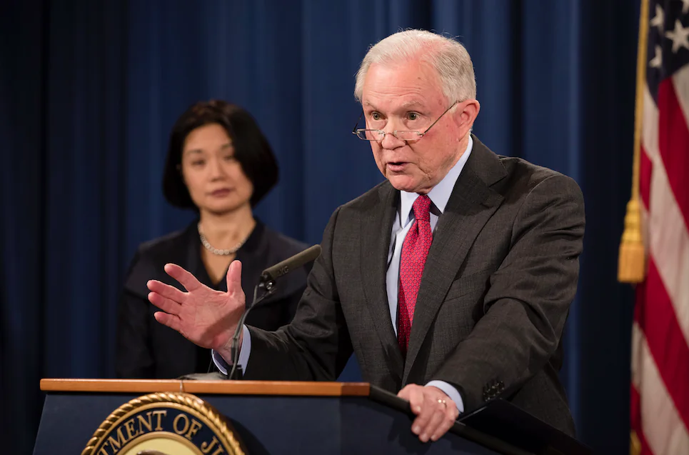 Attorney General Jeff Sessions (R) and U.S. Attorney Jessie K. Liu for the District of Columbia at a press conference at the Justice Department in Washington on Dec. 15, 2017. (Samira Bouaou/The Epoch Times)