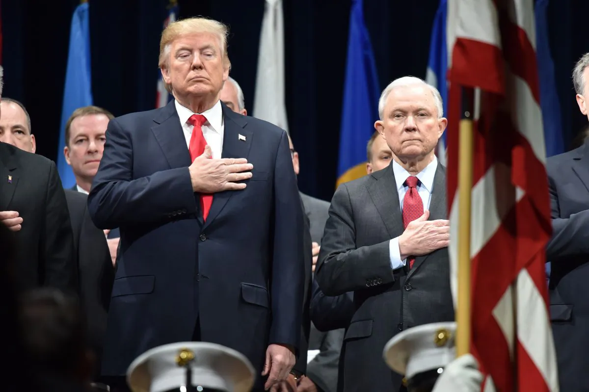 President Donald Trump and Attorney General Jeff Sessions stand at the FBI National Academy graduation ceremony in Quantico, Va., on Dec. 15, 2017. (Nicholas Kamm/AFP/Getty Images)