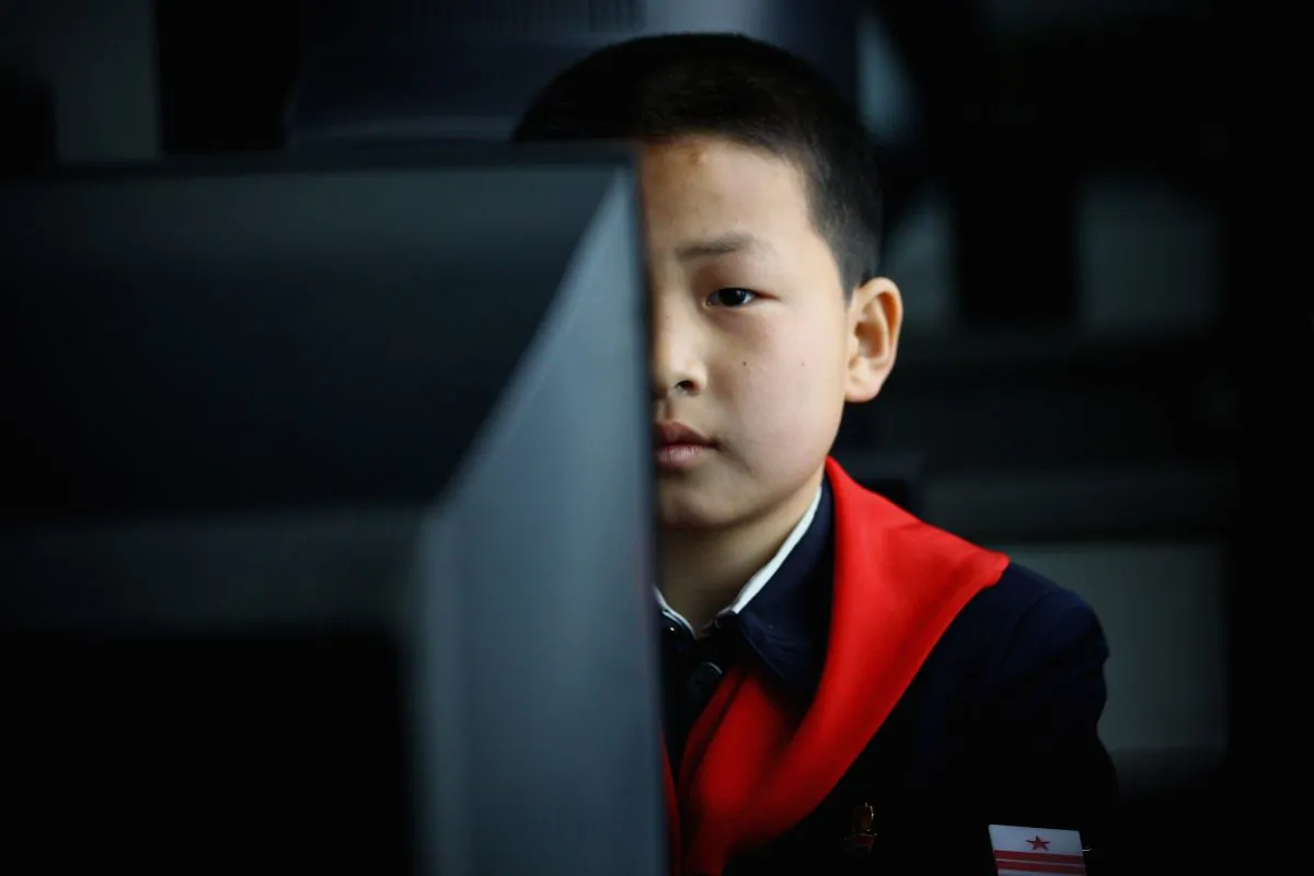 PYONGYANG, NORTH KOREA - APRIL 02: North Korean children learn to use the computer in a primary school on April 2, 2011 in Pyongyang, North Korea. Pyongyang is the capital city of North Korea and the population is about 2,500,000. (Photo by Feng Li/Getty Images)