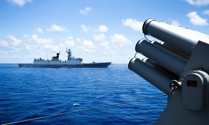 Vessels of China's South Sea Fleet taking part in a logistics supply drill near the James Shoal area on South China Sea on May 10, 2016.  Chinese regime claims sovereignty over almost the whole of the South China Sea, pitting it against several neighbors in the region. (STR/AFP/Getty Images)