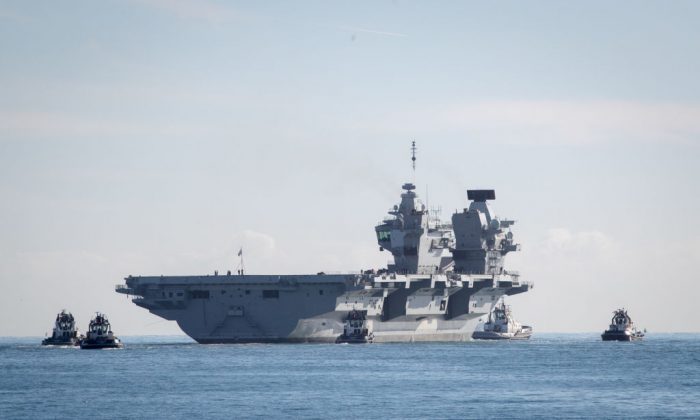 The Royal Navy's newest aircraft carrier HMS Queen Elizabeth departs Portmouth dockyard on Oct. 30, 2017 in Portsmouth, England. (Matt Cardy/Getty Images)