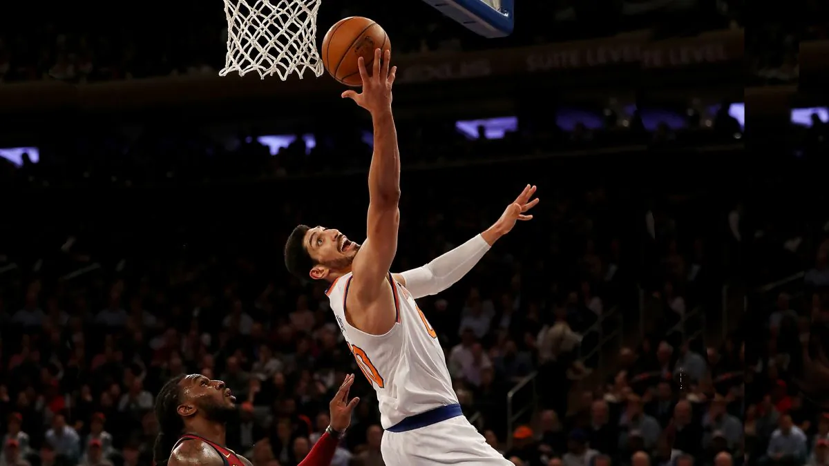 Enes Kanter #00 of the New York Knicks heads for the net as Jae Crowder #99 of the Cleveland Cavaliers defends at Madison Square Garden on November 13, 2017 in New York City.(Elsa/Getty Images)
